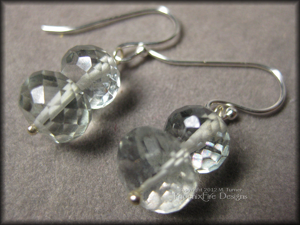 Gorgeous microfaceted mystic quartz rondelles in a beautiful pale mint color are stacked on .925 sterling silver pins and dangle from .925 ear wires.